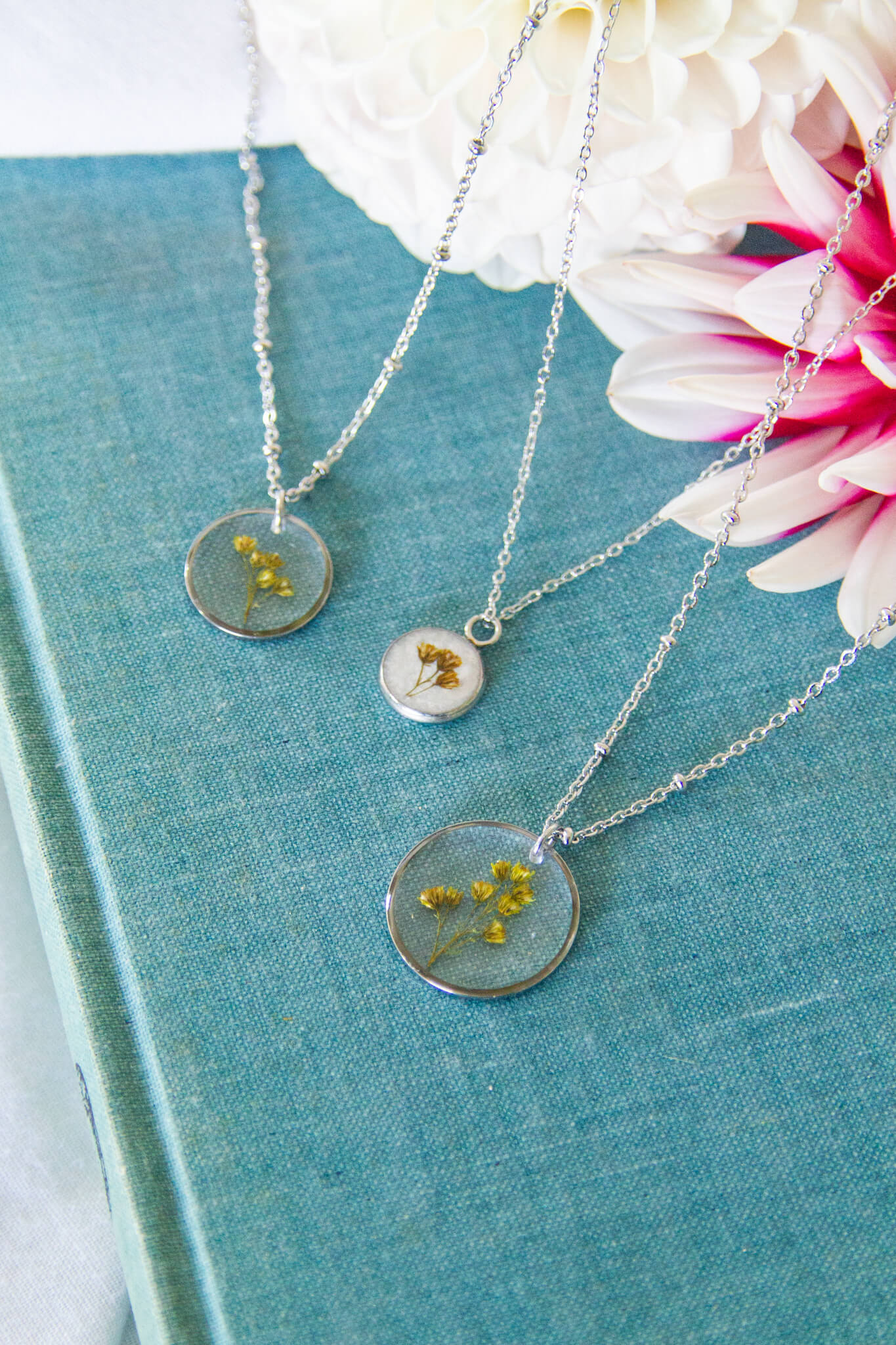 Botanical resin necklaces- Golden rod stainless-steel necklace with x-small circle, small circle & medium circle pendants