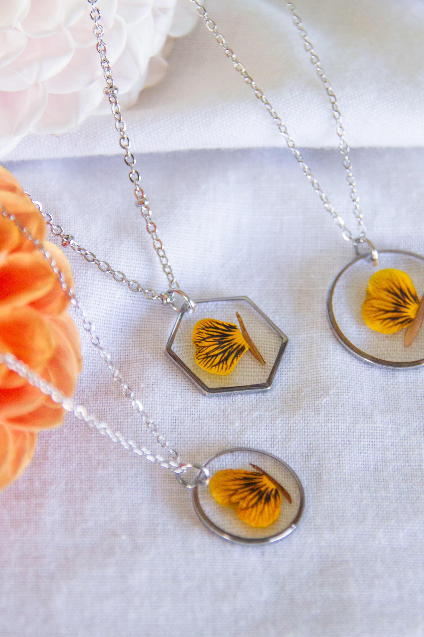 Botanical resin necklace- Orange viola stainless-steel necklace with small circle, medium circle & hexagon pendants