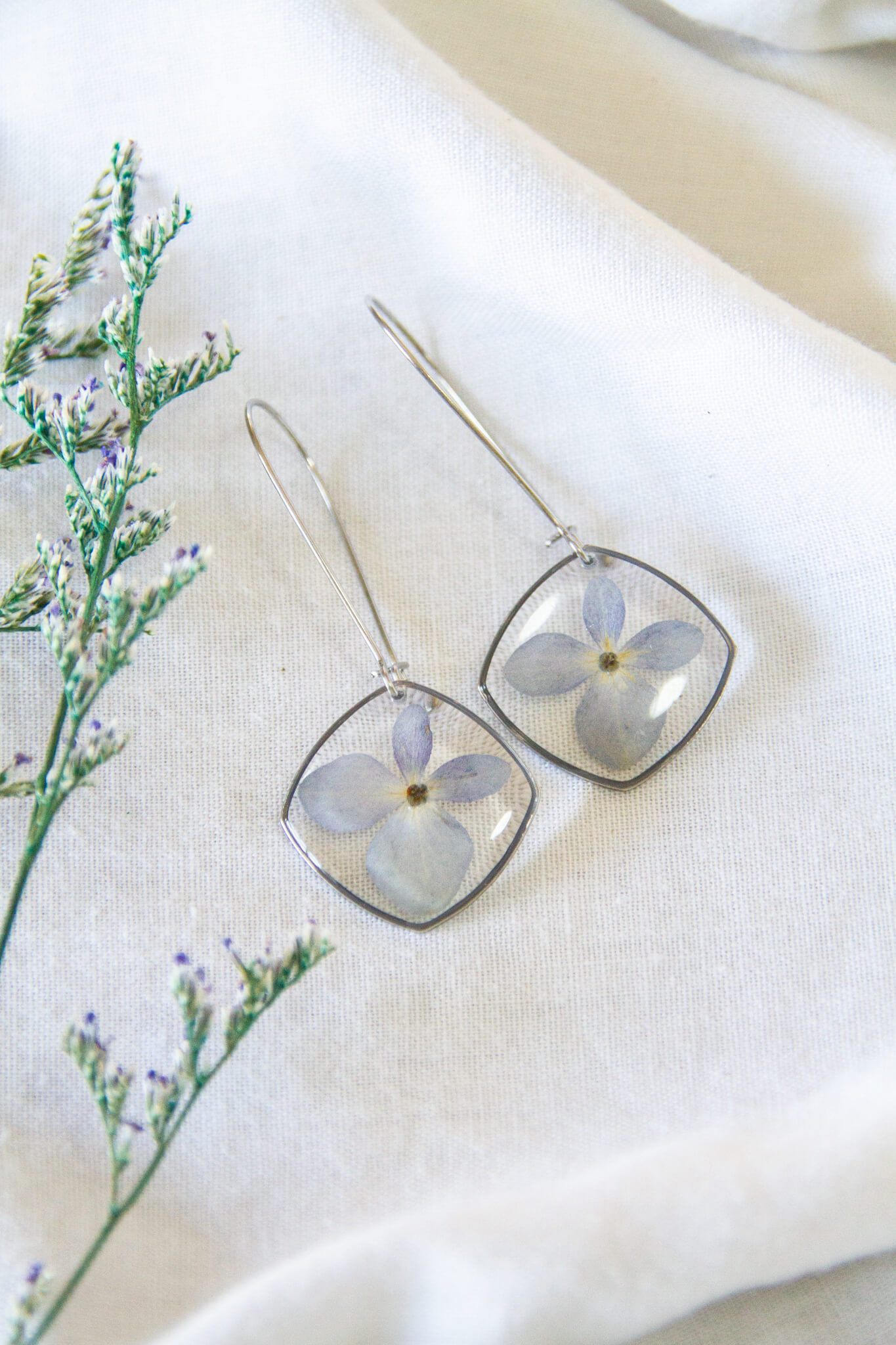 Botanical resin earrings: Blue Hydrangea stainless-steel earrings - 30mm kidney hooks with 23mm large rounded square pendants