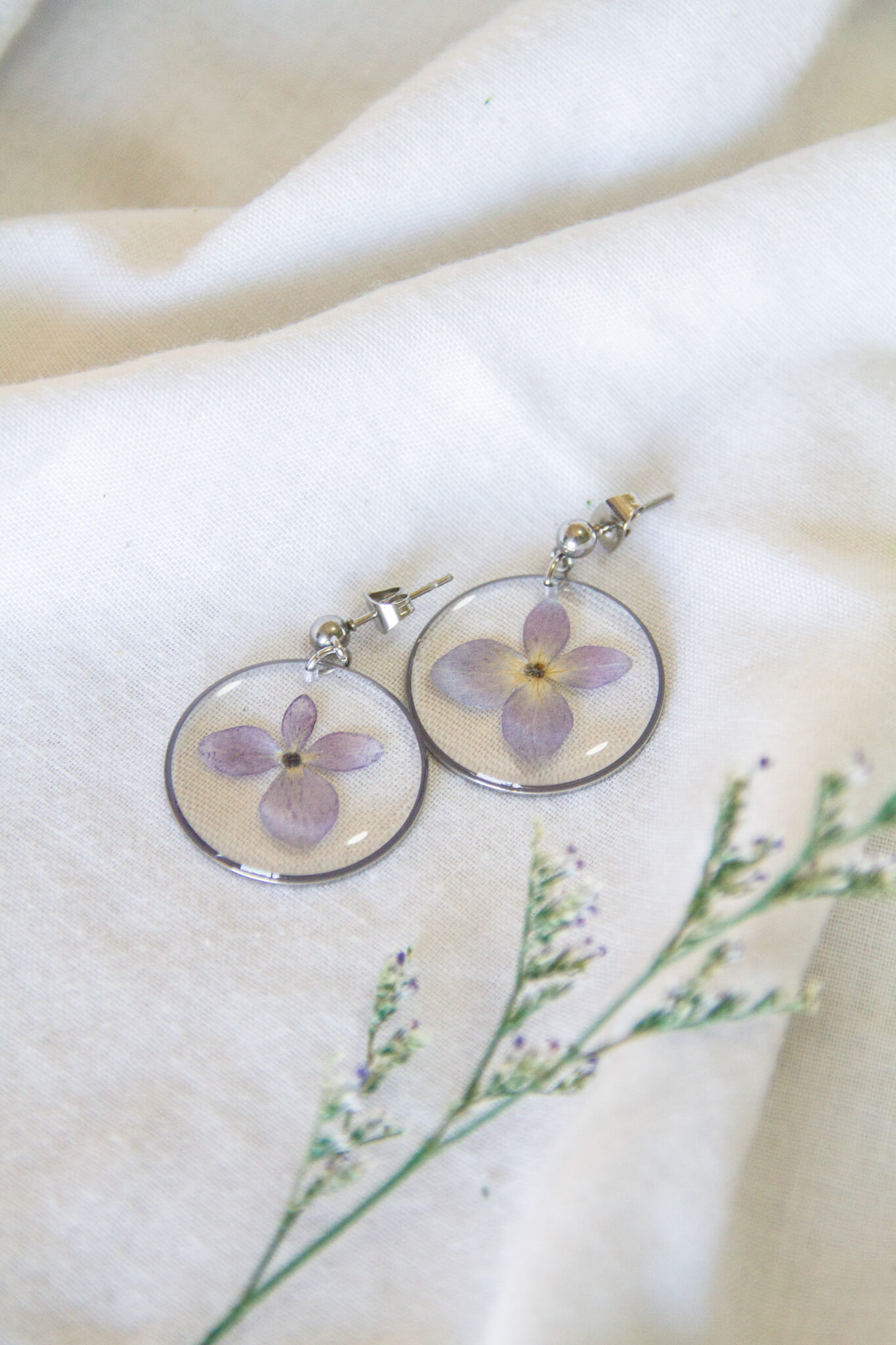 Botanical resin earrings: Purple Hydrangea stainless-steel earrings- 4mm ball studs with 25mm circle pendants